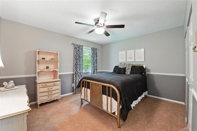 bedroom featuring baseboards and ceiling fan
