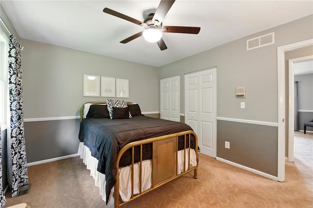 bedroom with baseboards, a ceiling fan, and light colored carpet