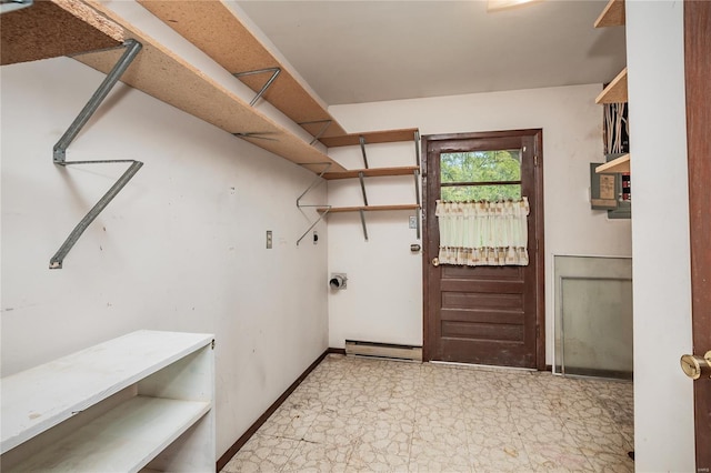 laundry room with tile patterned floors, laundry area, and baseboards