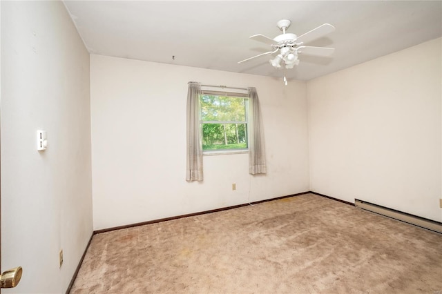 carpeted empty room featuring ceiling fan, a baseboard heating unit, and baseboards