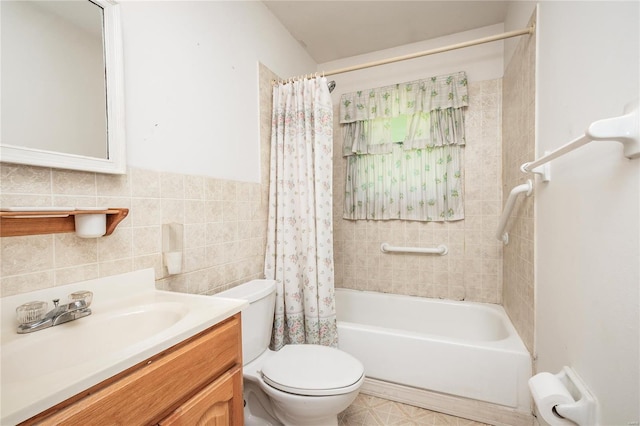 full bathroom with shower / tub combo, vanity, toilet, and tile walls