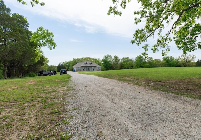 view of road with driveway and a rural view
