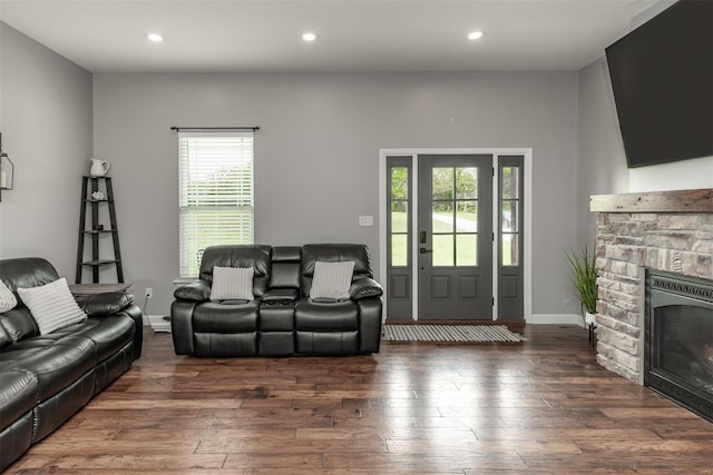 living room featuring a fireplace, recessed lighting, plenty of natural light, and hardwood / wood-style floors
