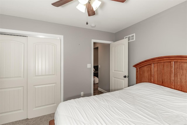 bedroom with a ceiling fan, a closet, and visible vents