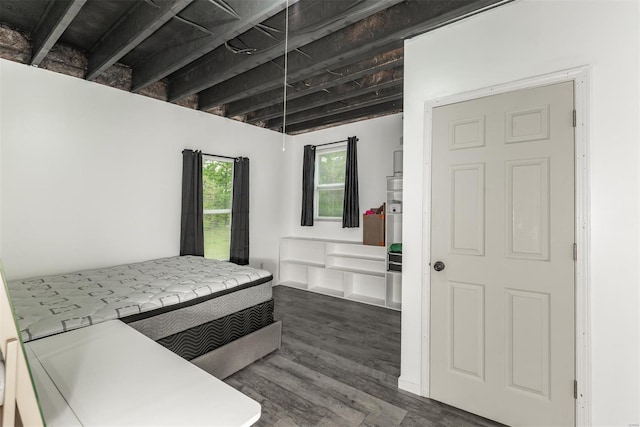 bedroom featuring wood finished floors
