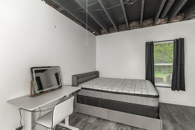 bedroom with wood finished floors