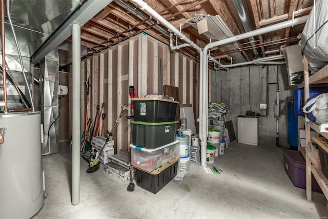unfinished basement featuring water heater