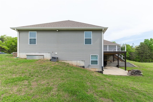 back of house featuring a patio, a lawn, stairway, and a deck
