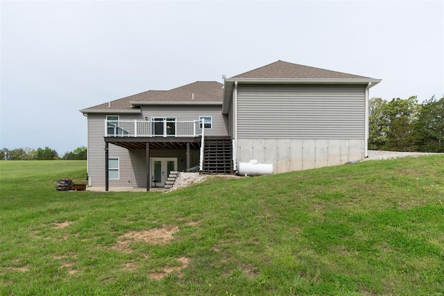 rear view of property featuring french doors, a yard, a deck, and stairway