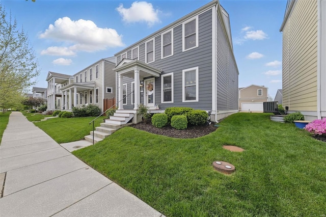 view of front of home featuring a front lawn and central air condition unit
