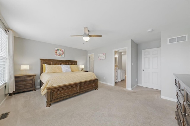 bedroom featuring light colored carpet, baseboards, visible vents, and a ceiling fan