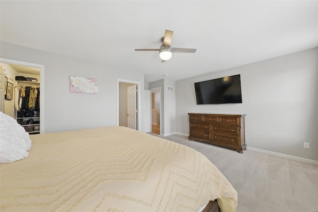 bedroom featuring baseboards, carpet, a ceiling fan, and visible vents