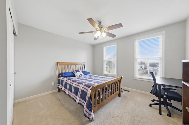 bedroom with baseboards, carpet flooring, and a ceiling fan