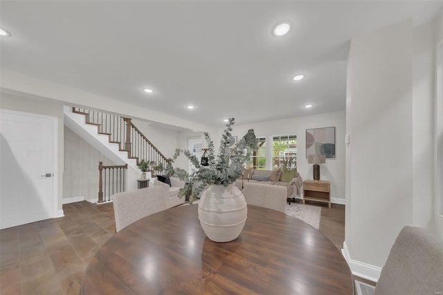 dining room featuring recessed lighting, stairway, and baseboards