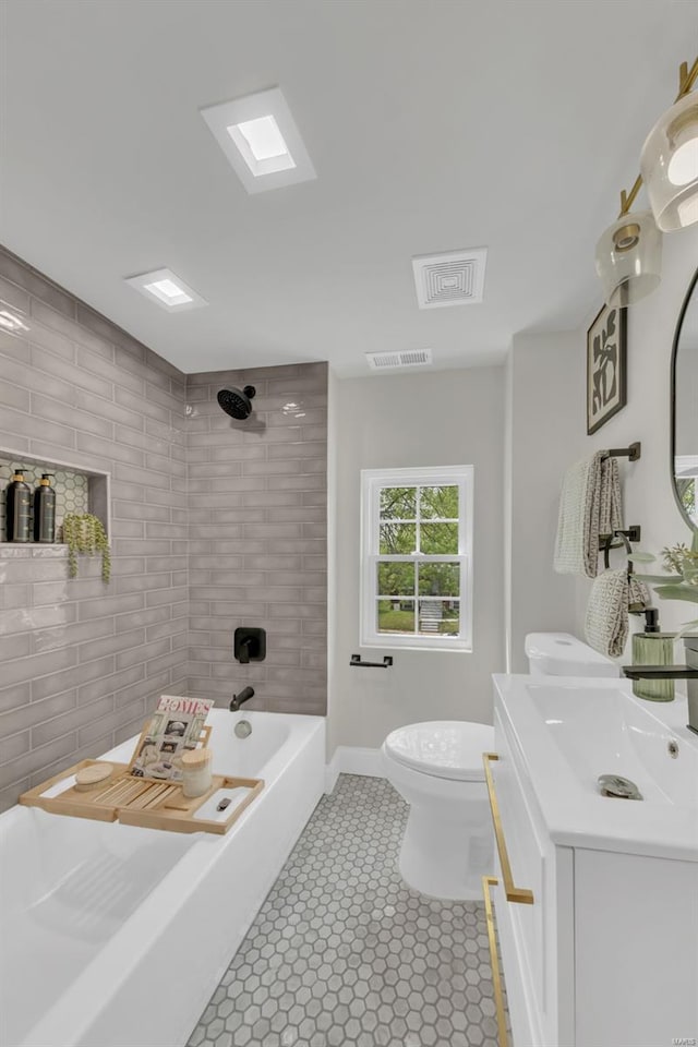 full bath with toilet, visible vents, tub / shower combination, and vanity