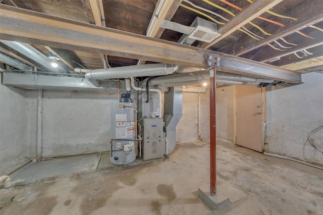 unfinished below grade area with gas water heater and heating unit