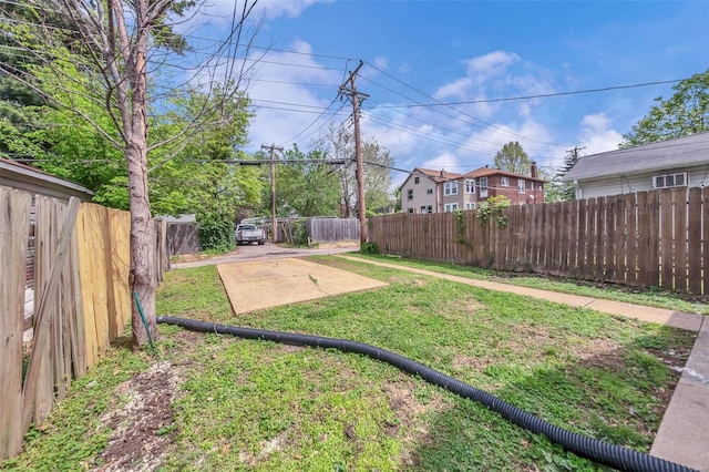 view of yard with a fenced backyard and a patio area