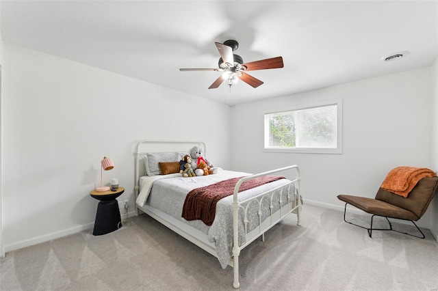 bedroom with carpet flooring, a ceiling fan, baseboards, and visible vents
