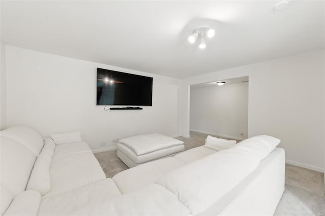 living room with light colored carpet and baseboards