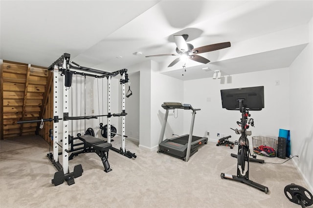 workout area with baseboards, carpet flooring, and ceiling fan