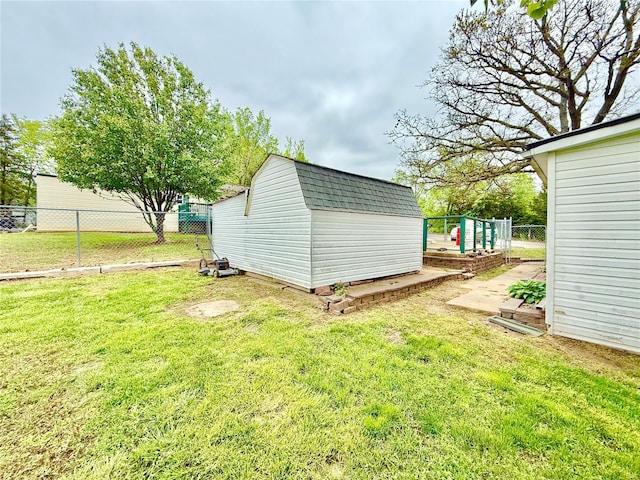 view of shed featuring fence