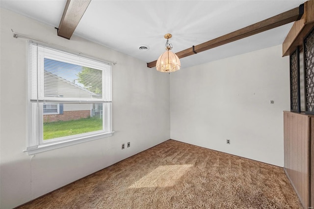 carpeted empty room with an inviting chandelier, plenty of natural light, beamed ceiling, and visible vents