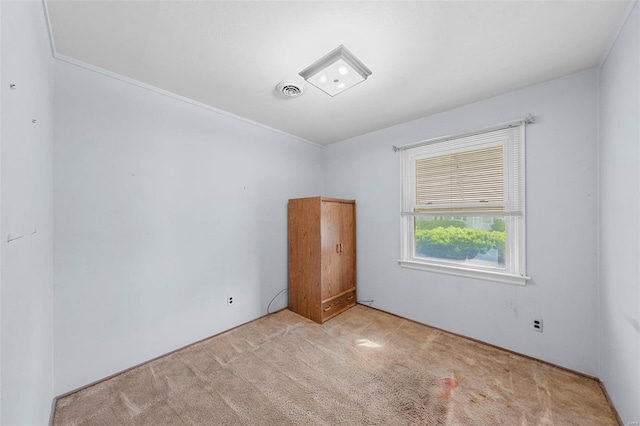 carpeted empty room with visible vents