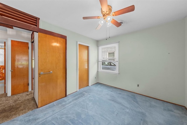 unfurnished bedroom featuring a closet, a ceiling fan, and carpet