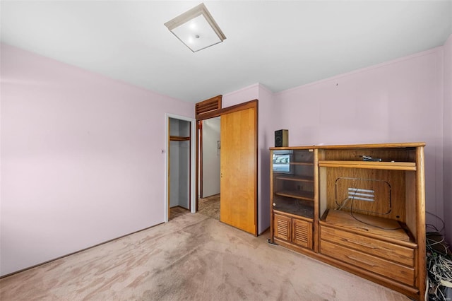 bedroom featuring light colored carpet