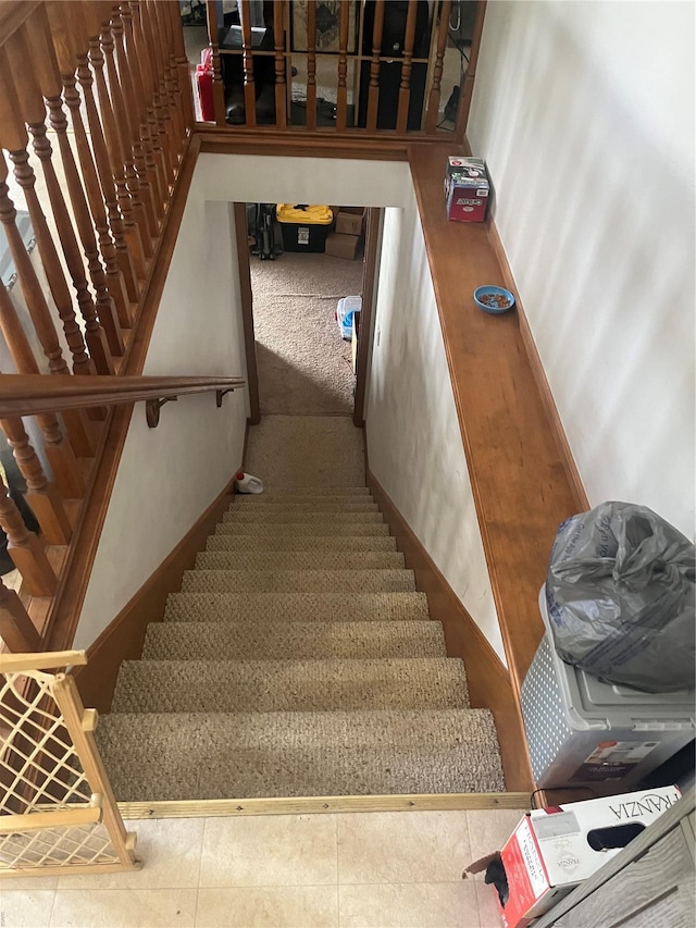 stairway with baseboards