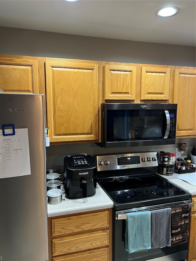 kitchen with light countertops and stainless steel appliances