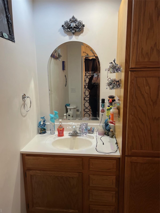 bathroom with vanity and toilet