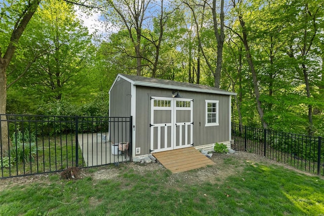 view of shed with a fenced backyard