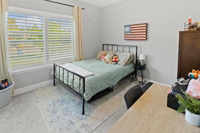 bedroom featuring baseboards