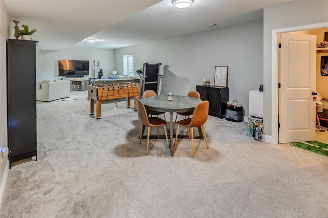 dining space featuring carpet flooring and visible vents