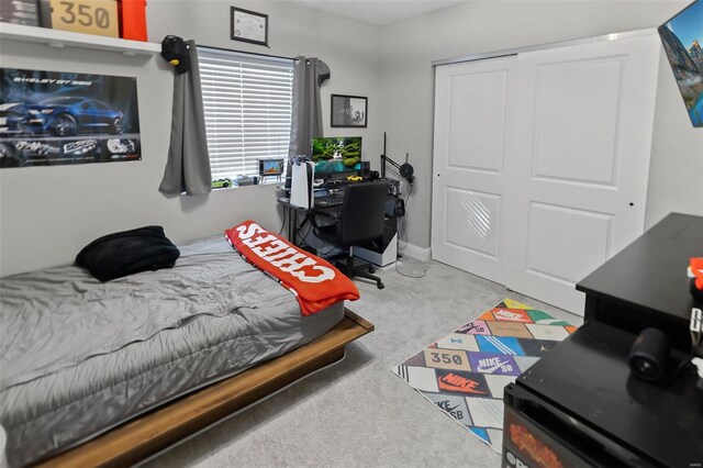 bedroom with a closet and carpet flooring