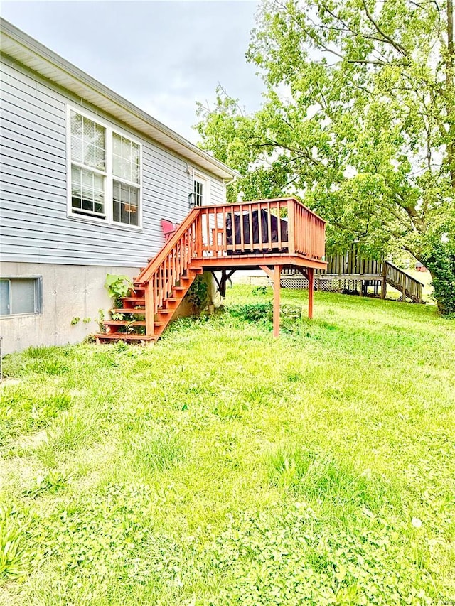 view of yard with stairway and a wooden deck