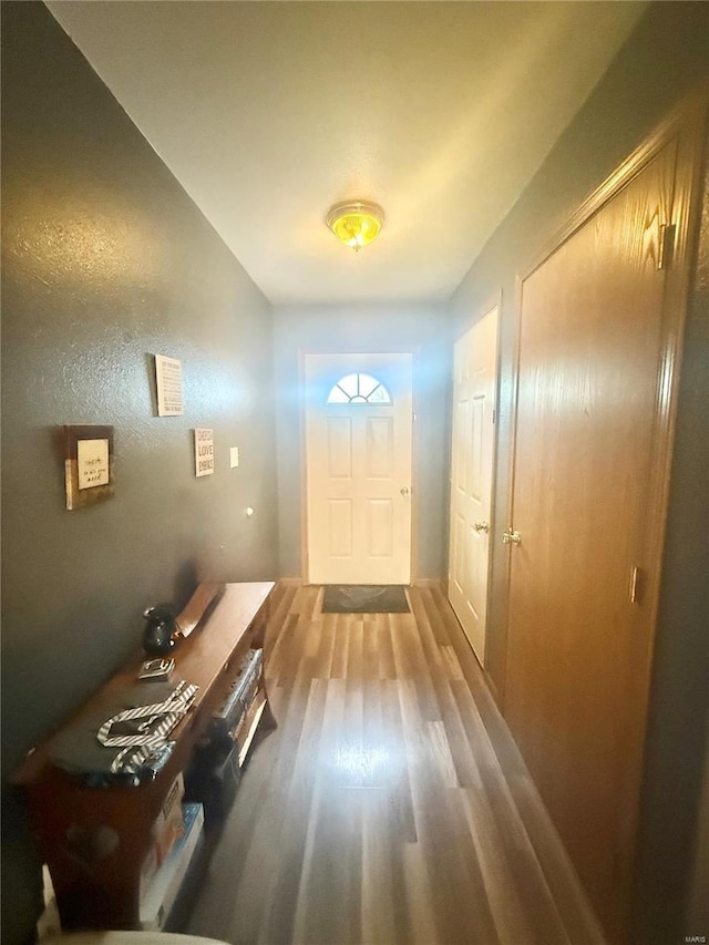 doorway to outside with wood finished floors