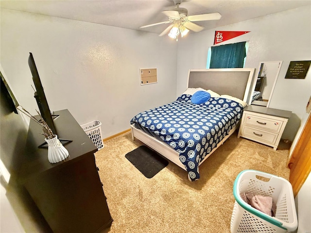 carpeted bedroom featuring a ceiling fan