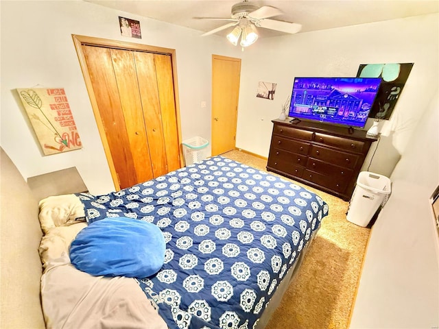 bedroom featuring a closet, a ceiling fan, and carpet floors