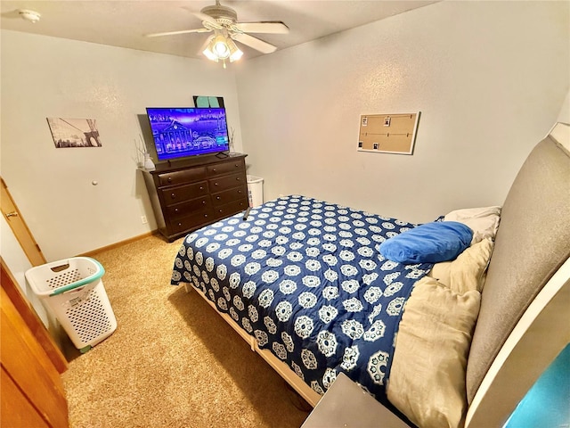 bedroom featuring ceiling fan and carpet floors