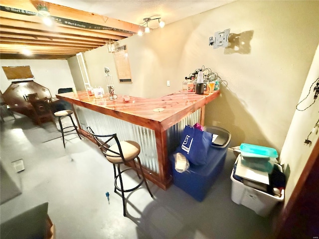 bar with concrete floors and bar