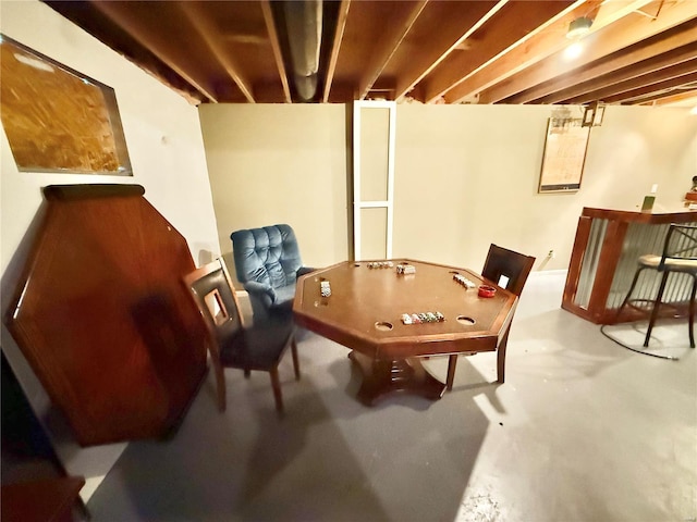 recreation room with finished concrete flooring