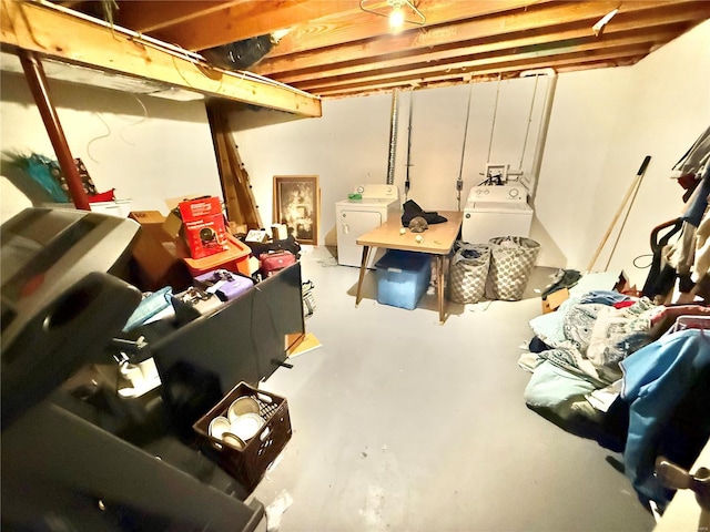 unfinished basement featuring separate washer and dryer