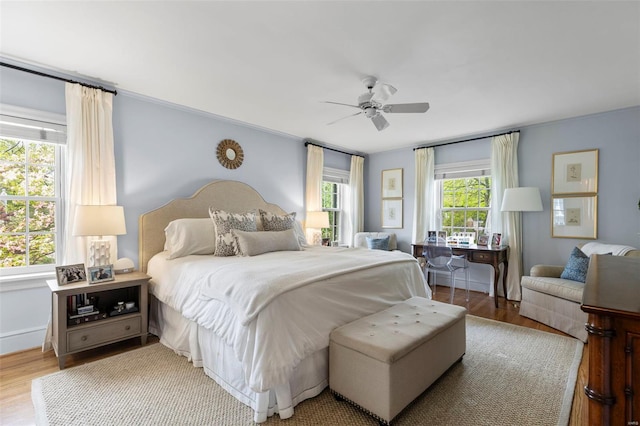 bedroom with wood finished floors and ceiling fan