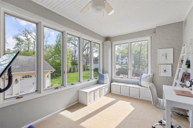 sunroom with carpet and visible vents