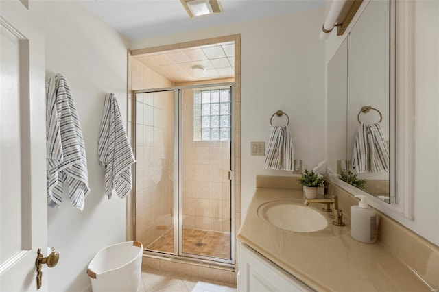 full bath with a stall shower, tile patterned flooring, and vanity