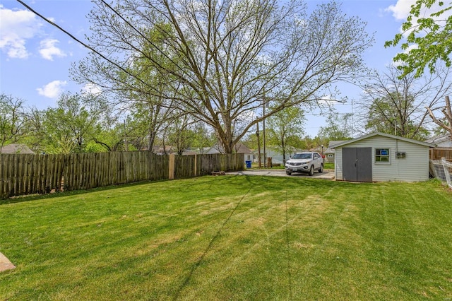 view of yard featuring an outdoor structure and fence private yard