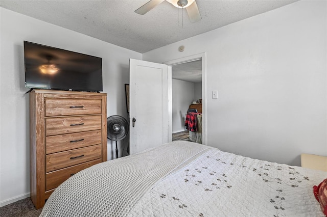 carpeted bedroom featuring ceiling fan and baseboards