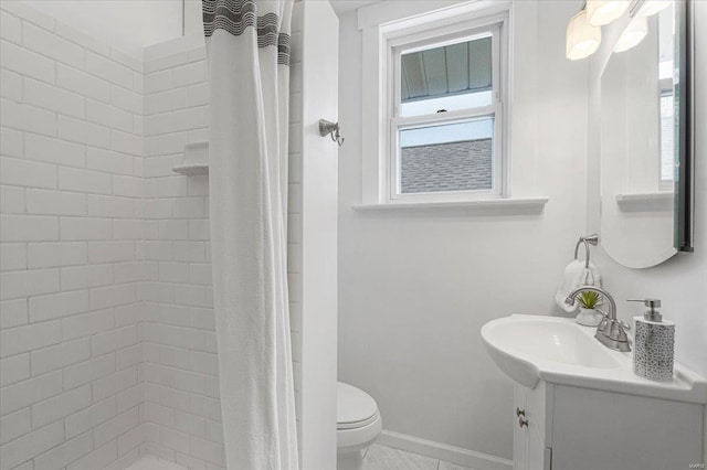 full bath with toilet, a tile shower, a wealth of natural light, and vanity